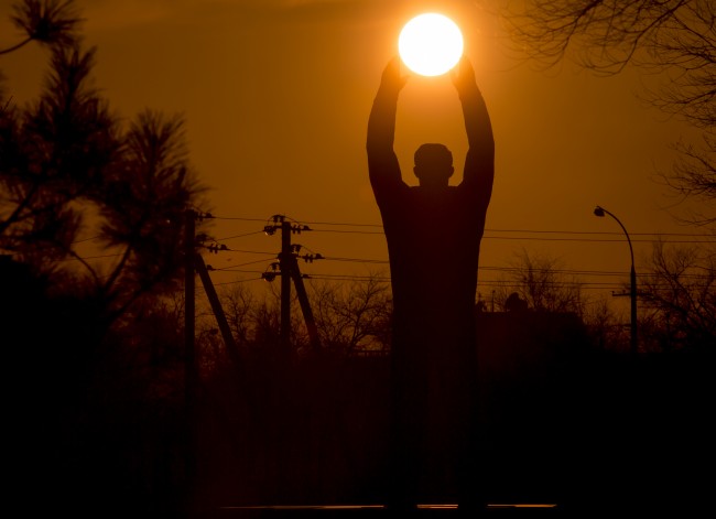 The sun sets over a sculpture of the first cosmonaut Yuri Gagarin at the Russian leased Baikonur cosmodrome