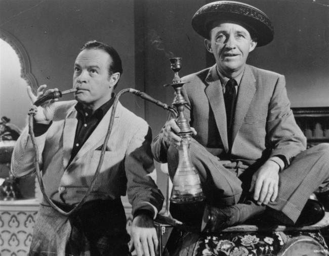 Bob Hope and Bing Crosby enjoy a smoke from a water pipe on March 30, 1962 photo in a scene from the 1962 film "The Road to Hong Kong" 