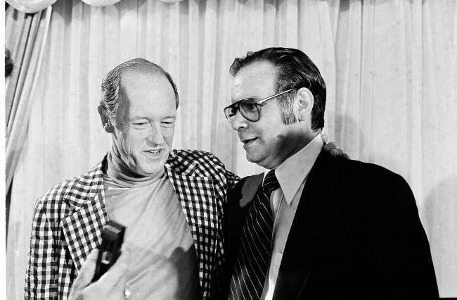Watergate burglar E. Howard Hunt, left, embraces Cuban exile Manuel Artime, a leader of the 1963 Bay of Pigs invasion of Cuba, after a news conference in Miami, March 3, 1977.