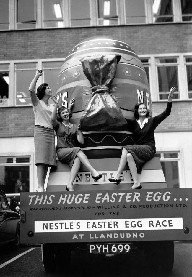 Young ladies with a giant Easter egg before it left for the 'Easter Spectacular' in Llandudno, north Wales.