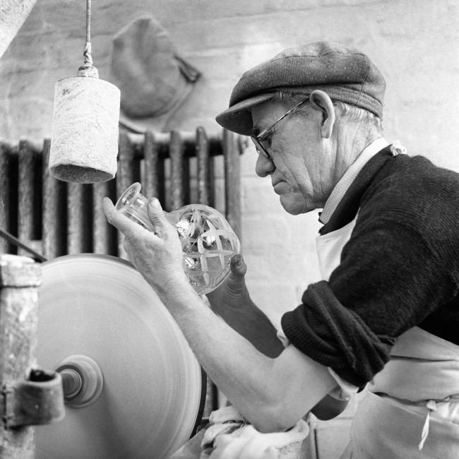 The skill of 48 years at the job goes into the work as Harry Jones hand-cuts a crystal decanter at a Stourbridge, Worcestershire, firm.