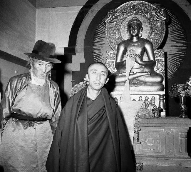 Silun Lukhwangwa, former Tibetan Premier (left) and Kushak Bakula, India?s leading Lama, leave Buddhist temple in New Delhi, India on March 31, 1959 after conducting prayers for Tibetans fighting Chinese communists in Tibet. Prime Minister Nehru of India spoke to refugees, led by Lukhwangwa in New Delhi and prophesied ?ultimate victory for Tibetans but urged them to be patient.