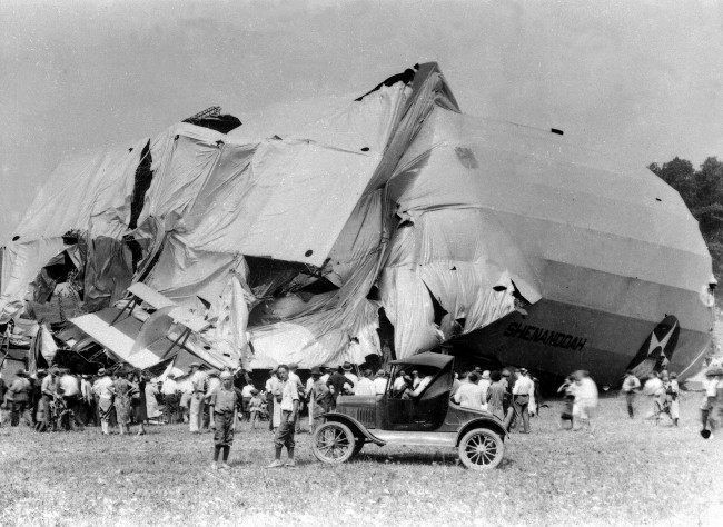 The airship USS Shenandoah lies in ruins in Caldwell, Ohio on Sept. 4, 1925. Fourteen crew members died and twenty-nine crew members survived the destruction of the airship which took off from Lakehurst, N.J., on Sept. 2. The Shenandoah was the first rigid dirigible made in America. 