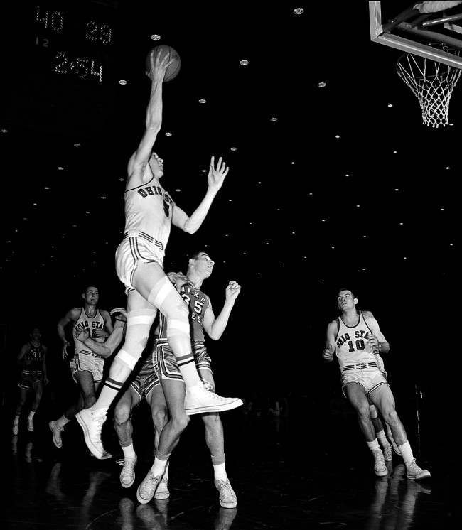 Ohio State's forward John Havlicek leaps into the air to toss a one-hander in the first round of the NCAA finals against Wake Forest, at Louisville, Ky., March 23, 1962.
