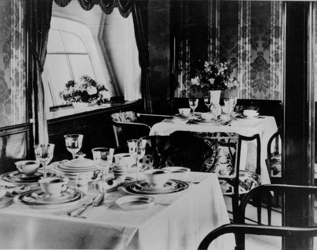 The Salon is transformed into a dining room aboard the German airship Graf Zeppelin circa 1928.