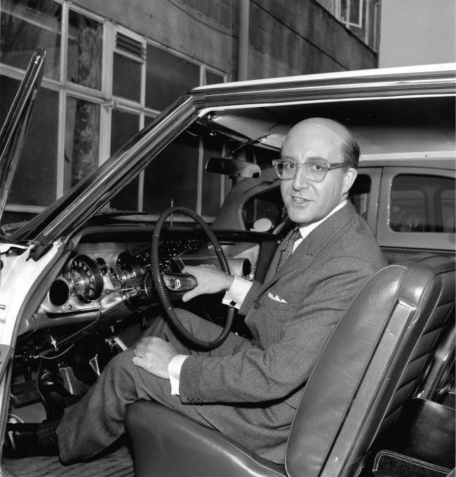 British actor Peter Sellers shows his new 1963 American Buick during a break in filming at Shepperton Studios in Middlesex, near London, England, March 3, 1963. Sellers is wearing a bald piece for his character in the movie