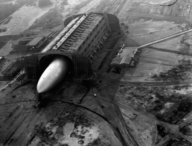 The German zeppelin Hindenburg, its nose hooked to a mooring mast, is guided into a U.S. Navy dirigible hangar in Lakehurst, NJ, May 9, 1936, after the first leg of 10 scheduled round trips between Germany and the U.S.