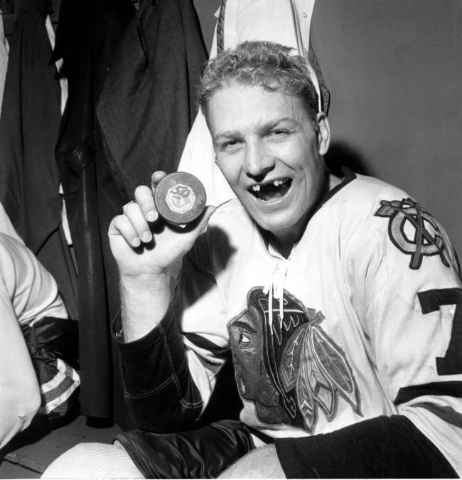 Bobby Hull of Chicago Blackhawks holds puck which he drove into New York Rangers' net to score his 50th goal of the season and to tie the National Hockey League record in the final game of this regular season. The 25-year-old scored less than five minutes into the game in New York's Madison Garden on March 25, 1962. Rangers won 4-1. 