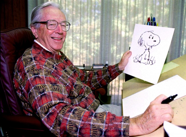 - In this Sept. 29, 1995, fie photo, cartoonist Charles Schulz holds a drawing of his famous comic strip character "Snoopy" in Santa Rosa, Calif. Schulz, the creator of "Peanuts", penned the round faced boy Charlie Brown, and his dog Snoopy. E.W. Scripps Co. said Tuesday, April 27, 2010, it will sell the unit that owns the licensing rights to Snoopy, Charlie Brown and the rest of the "Peanuts" gang for $175 million to Joe Boxer owner Iconix Brand Group Inc. 