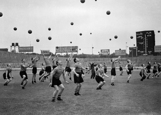 Players practice heading the ball Date: 29/07/1955