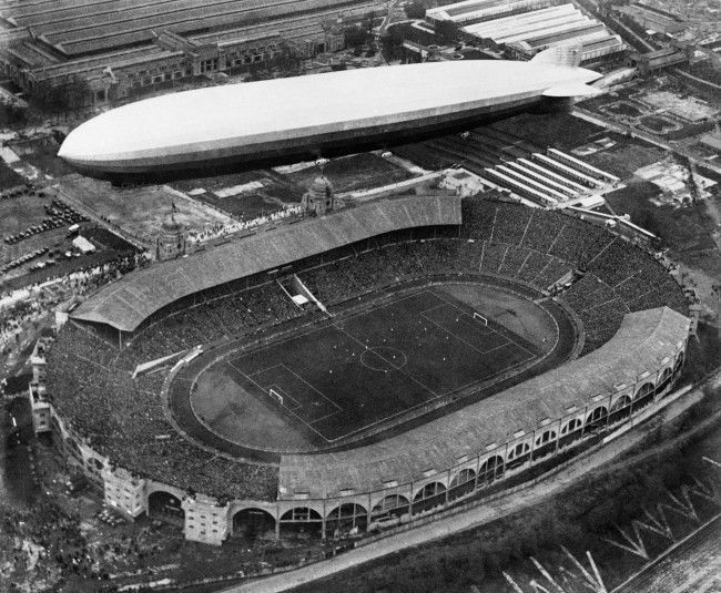 A Graf Zeppelin flying over Wembley Stadium in London, England on April 26, 1930, while the football cup final match between Huddersfield and Arsenal was in progress