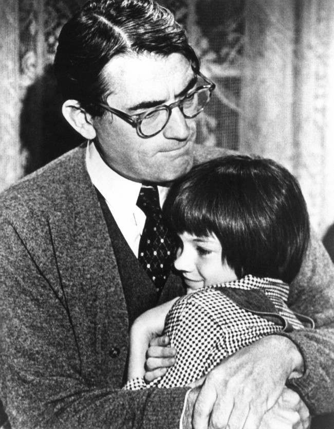 Gregory Peck embraces Mary Badham, 9, a Birmingham Alabama acting discovery who plays his daughter in To Kill a Mockingbird