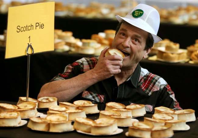 2013: Les McKeown, the one-time front man for Bay City Rollers judges the 15th World Scotch Pie Championship at Carnegie Conference Centre in Dunfermline. Picture by: Andrew Milligan/PA Wire/Press Association Images