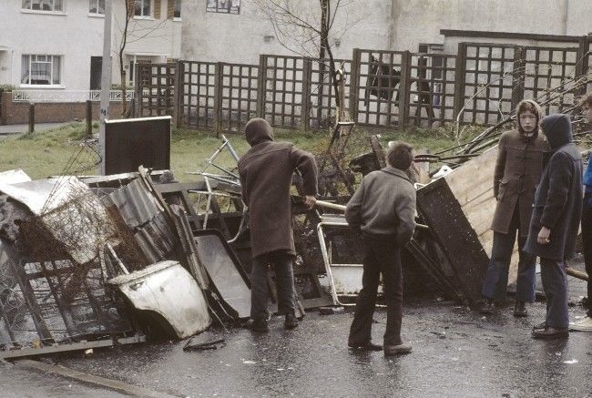Local residents erect a barricade across the road in the Turf Lodge area of Belfast, Northern Ireland on April 30, 1981, during preparations for possible civil disorders, which are expected to follow the imminent death of IRA hunger striker Bobby Sands. Sands is into the 61st day of a hunger strike in Northern IrelandÂs Maze Prison. (AP Photo/Peter Kemp) Ref #: PA.10424388  Date: 30/04/1981 