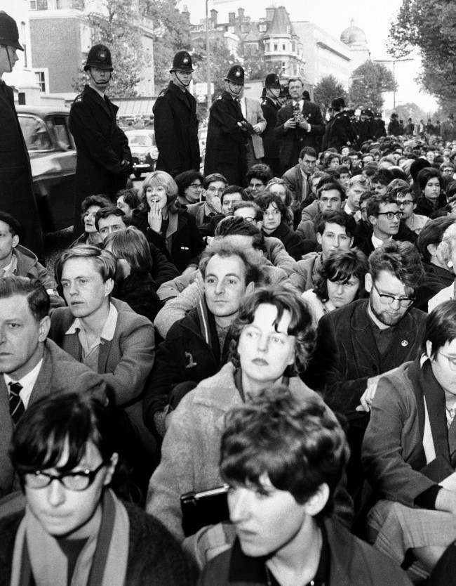 Police line bayswater road in London on Oct. 21, 1961, alongside squatting ban-the-bomb demonstrators near the soviet embassy. 