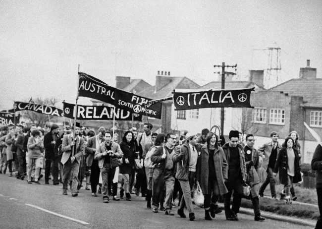 Foreign groups (from Italy, Fiji, Australia, Canada and Algeria) are in the column of marchers as some 10,000 supporters of the Campaign for Nuclear Disarmament set out from Reading, Berkshire on April 21, 1962, on the second leg of their protest march from Aldermaston to London. The ban-the-bomb demonstrators spent the night under canvas outside Reading.