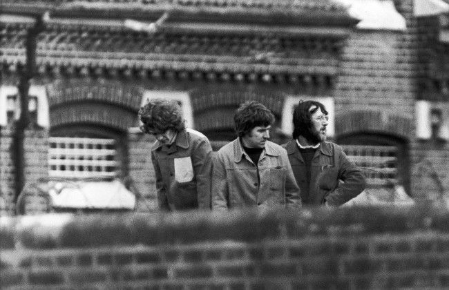 Three prisoners staging a protest on the roof of Wormwood Scrubs jail in London on April 26, 1981. They climbed onto the roof during an exercise period and began yelling slogans about IRA hunger striker Bobby Sands. (AP Photo) Date: 26/04/1981