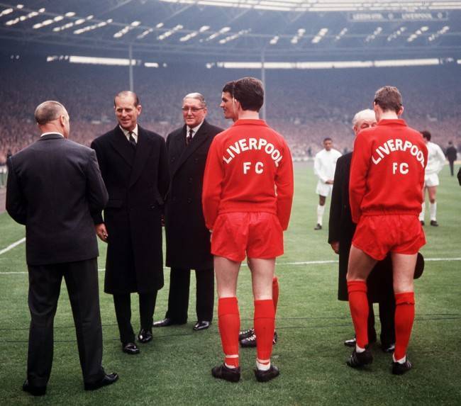 Liverpool football manager Bill Shankly (left, back to camera) is greeted by the Duke of Edinburgh (2nd left),