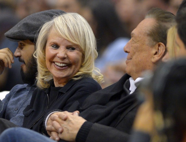 Los Angeles Clippers owner Donald T. Sterling, right, sits with his wife Rochelle during the first half of the Clippers' NBA basketball game against the Houston Rockets, Wednesday, Feb. 13, 2013, in Los Angeles.