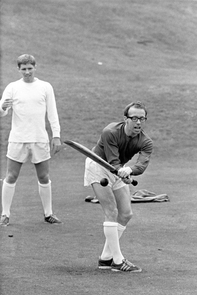 Nobby Stiles playing cricket, during England's World Cup team's preparation at Roehampton, London, before their semi-final match against Portugal at Wembley Stadium. Fielding in the picture is Alan Ball. Ref #: PA.1737871  Date: 25/07/1966