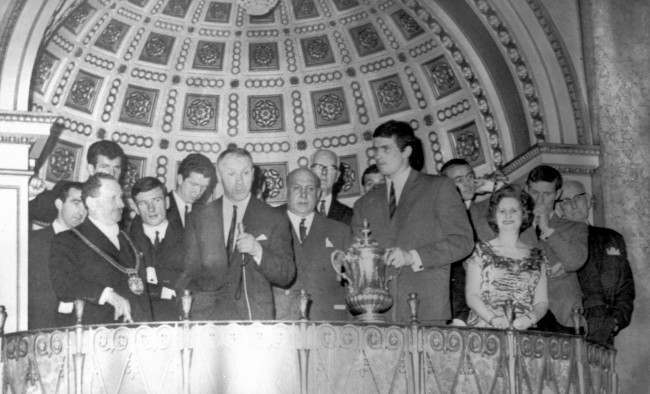 Liverppol manager Bill Shankly addressing the guests who welcomed the Liverpool team at a civic reception at the Town Hall on their return to Liverpool after beating Leeds United in the Cup Final at Wembley. On left is the Lord mayor of Liverpool, Alderman Louis Caplan. Others in the photo are players Byrne, Stevenson, Smith, Lawler, Liverpool Chairman S. Reakes, Callaghan, Yeats (holding FA Cup, captain Ian St John, the Lady Mayoress fanny Bodker, Stevenson and T.V Williams, Preseident of Liverpool FC