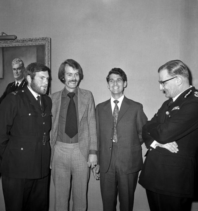 Commissioner of Police for the Metropolis, Sir Robert Mark (r) talks with the three police officers who are to receive bravery awards for protecting Princess Anne during the attempted kidnapping by Ian Ball. (l-r) PC Michael Hills receives the George Medal, Detective Constable Peter Edmonds is awarded the Queen's Gallantry Medal and Princess Anne's bodyguard, Inspector James Beaton is awarded the George Cross. 923-Archive-pa167112-6 Ref #: PA.19319415  Date: 05/07/1974