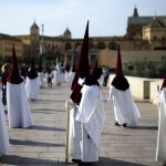 Penitents Of The “La Vera Cruz” Brotherhood Take Part During a Holy Week Procession in Cordoba
