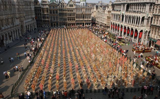 People view sculptures by the German environmental artist HA Schult at the Grand Place in Brussels, Friday April 1, 2005. The 1,000 different sculptures of 'Trash People' are intended to draw people's attention to environmental problems. The exhibit opened on March 31 and runs until April 4, 2005. (AP Photo/Geert Vanden Wijngaert)