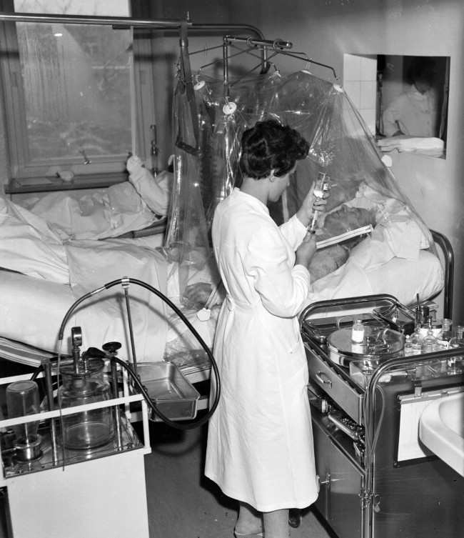 Matt Busby, manager of the Manchester United football team which was involved in the Munich air crash, is seen in an oxygen tent at Munich Hospital, Febuary 7th, 1958. Busby was seriously injured in the crash and seven other members of the football team were killed.
