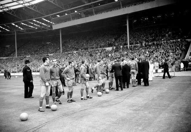 The Liverpool team are introduced to the assembled dignitaries before the match 