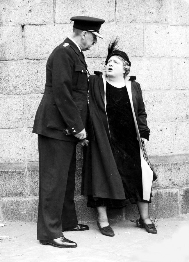 Abolition of capital punishment agitator Violet van Der Elst argues with a police officer outside Holloway Prison, London, July 13, 1955, after she had protested against the execution of Ruth Ellis for murder.