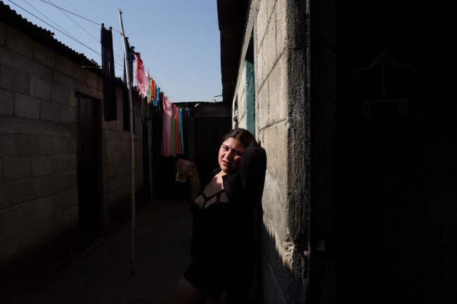 A prostitute who goes by the name in Spanish "Gata Salvaje" or "Wild Cat," waits for clients