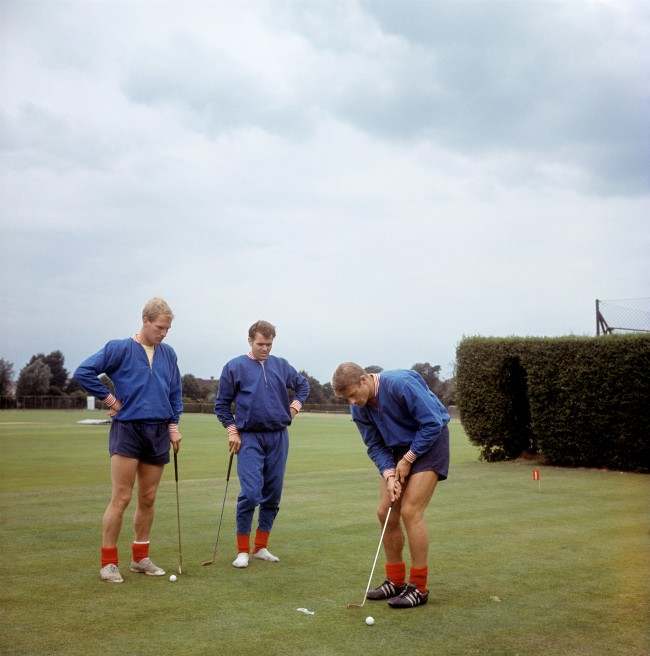England's Roger Hunt putts watched by Ron Flowers and John Connelly (C) at Roehampton Archive-900-76 Ref #: PA.5136490  Date: 29/07/1966
