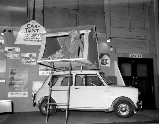 A model demonstrating a car tent. Ref #: PA.6394933  Date: 08/01/1963