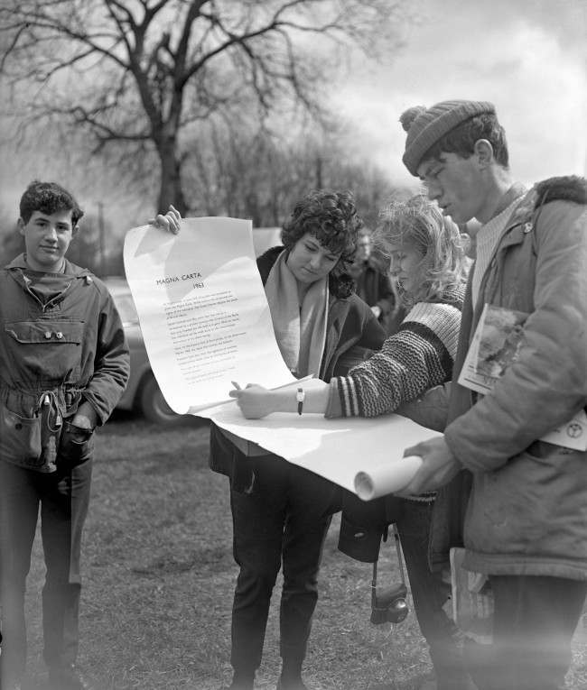 Some of the marchers sign a "Magna Carta 1963" at Runnymede, on the site of the signing of the original Magna Carta 750 years ago. Ref #: PA.8520226  Date: 14/04/1963