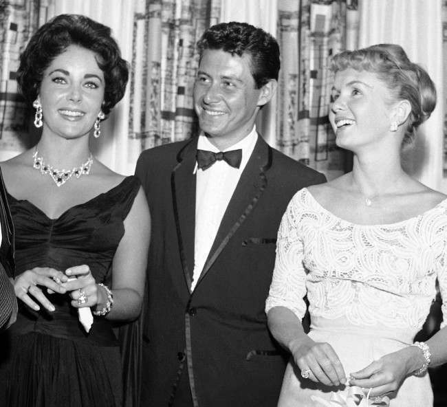 - Elizabeth Taylor, Eddie Fisher and Debbie Reynolds, from left to right, are shown attending the opening show starring Fisher at the Tropicana, in this June 19, 1958 file photo taken in Las Vegas, Nev. 