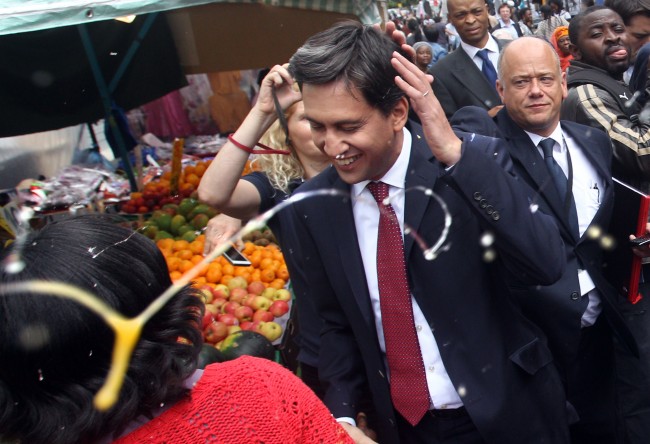 File photo dated 14/08/13 of Labour leader Ed Miliband after he was pelted with eggs during a campaign visit in East Street market in Walworth, south London