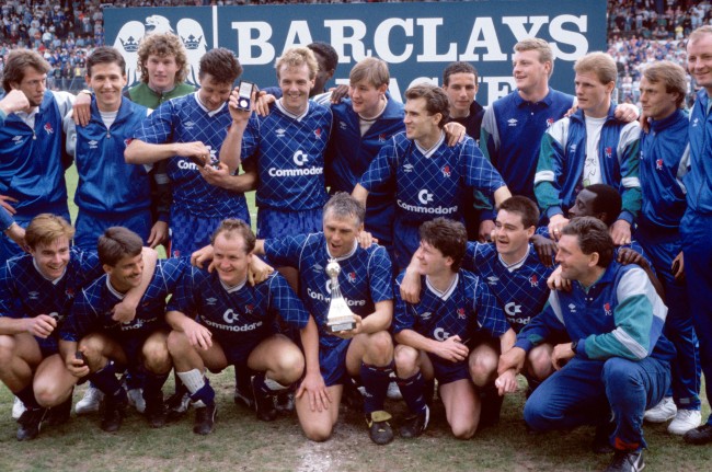 Soccer - Barclays League Division Two - Chelsea v Bradford City - Stamford Bridge Chelsea players celebrate with the Division Two championship trophy after clinching the title with a 3-1 victory: (back row, l-r) Dave Mitchell, Kevin Hitchcock, Dave Beasant, Joey McLoughlin, Kerry Dixon, ?, ? Tony Dorigo, ?, ?, Gordon Durie, John Bumstead, ?; (front row, l-r) Gareth Hall, Kevin Wilson, Peter Nicholas, Graham Roberts, Kevin McAllister, Steve Clarke, Clive Wilson, assistant manager Ian Porterfield (front) 