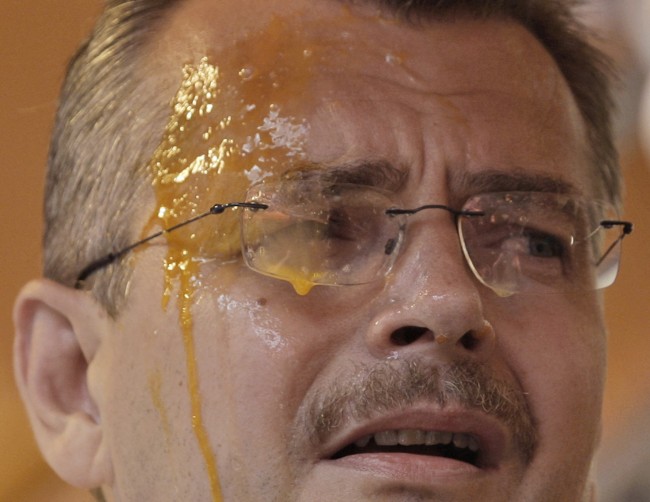Head of the Czech Republic Social Democratic Party's election campaign Jaroslav Tvrdik, after being hit with eggs thrown by onlookers during a rally for the European Parliament elections in Prague, Czech Republic, Wednesday, May 27, 2009. More than 40,000 people joined the 'Eggs for Paroubek in every town' campaign, opposing the Social Democratic Chairman Jiri Paroubek, on social networking website Facebook, and have disrupted with eggs, a number of Social Democratic rallies across the country. The European parliament is facing elections across the bloc's 27 members in early June.
