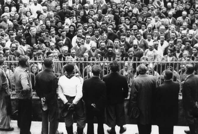 The men folk of the fishing village of Grandcamp Les Bains in Normandy, France , are being addressed by members of the resistance committee to voluntarily register for the new army of France. Date: 30/06/1944