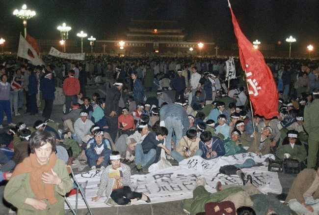 About 3,500 university students from more then a dozen school demand democracy and freedom keep on hunger strike at night, Saturday, May 14, 1989 in Beijing at Tiananmen Square. Students said they would end the hunger strike only when the government agrees to "equal and sincere" talks to their demands. (AP Photo/Sadayuki Miakmi)