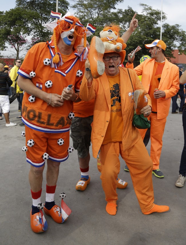 Dutch fans cheer for their national team before the group B World Cup soccer match between the Netherlands and Chile at the Itaquerao Stadium in Sao Paulo, Brazil, Monday, June 23, 2014. (AP Photo/Thanassis Stavrakis)