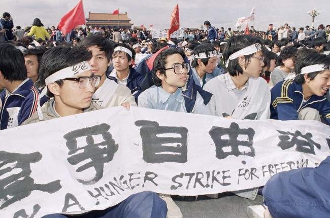 University students sit in Tiananmen Square on Saturday, May 13, 1989 in Beijing on a hunger strike for freedom and democracy. The students vow to sit until the arrival of Soviet leader Mikhail Gorbachev on Monday. (AP Photo)