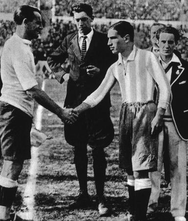 World Cup Final 1930 Montevideo, Uruguay, Uruguay 4 v Argentina 2. Belgian referee John Langenus looks on as Uruguay's captain Jose Nasazzi shakes hands with Argentina's Manuel Ferreira.