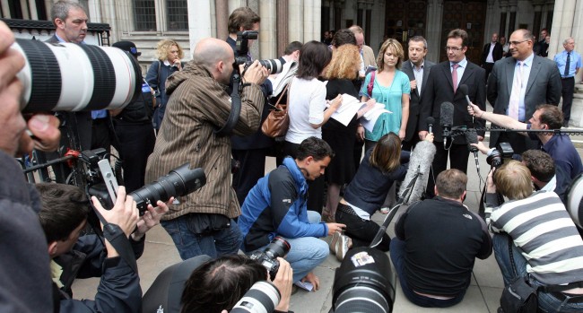 Robert Murat (right) makes a statement to the media outside the High Court, central London. He today accepted "very substantial" libel damages from several news outlets over allegations that he was involved in the abduction of Madeleine McCann.  Picture date: Thursday July 17, 2008. 