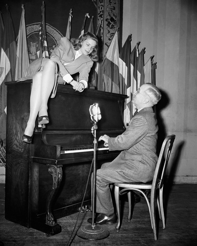  In this Feb. 10, 1945 file photo, Vice President Harry S. Truman plays the piano as new movie star Lauren Bacall lies on top of it during her appearance at the National Press Club canteen in Washington. Through the years, commanders-in-chief have turned musicians-in-chief, with varying results. (AP Photo)