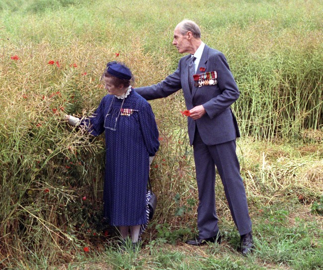 World War Two hero Group Captain Leonard Cheshire, later Lord Cheshire, with his wife Lady Ryder (Sue Ryder), among the poppies near the Lochnagar Crater on the Somme, paying their respects to the War dead. *03/11/2000 Sue Ryder died, Thursday November 2, 2000, aged 77. She had been ill for some time and was admitted to Bury St Edmunds Hospital, Suffolk, in January 2000 Ref #: PA.1360941  Date: 04/07/1989 