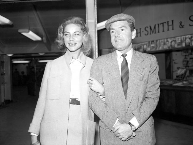 American actress Lauren Bacall and British actor Kenneth More at London Airport. They were flying to India to shoot scenes for their film North West Frontier. Date: 29/03/1959