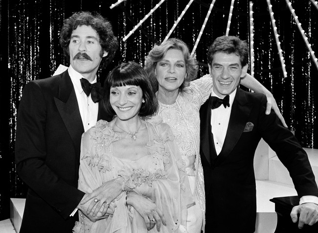 Four winners pose onstage at the Tony Awards presentation show in New York, June 7, 1981. From left are: Kevin Kline, best actor in a musical for " Pirates; " Jane Lapotaire, best actress in a play for " Piaf; " Lauren Bacall, best actress in a musical for " Woman of the Year; "and Ian McKellen, best actor in a play for "Amadeus." (AP Photo)