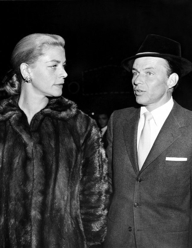 Frank Sinatra, right, and Lauren Bacall arrive at a film preview of "Pal Joey" in Hollywood, Ca., in Nov. 1957.